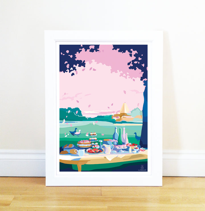 Becky Bettesworth artwork depicts a colourful picnic scene with food, drinks, and birds under trees against a landscape with a pink sky.