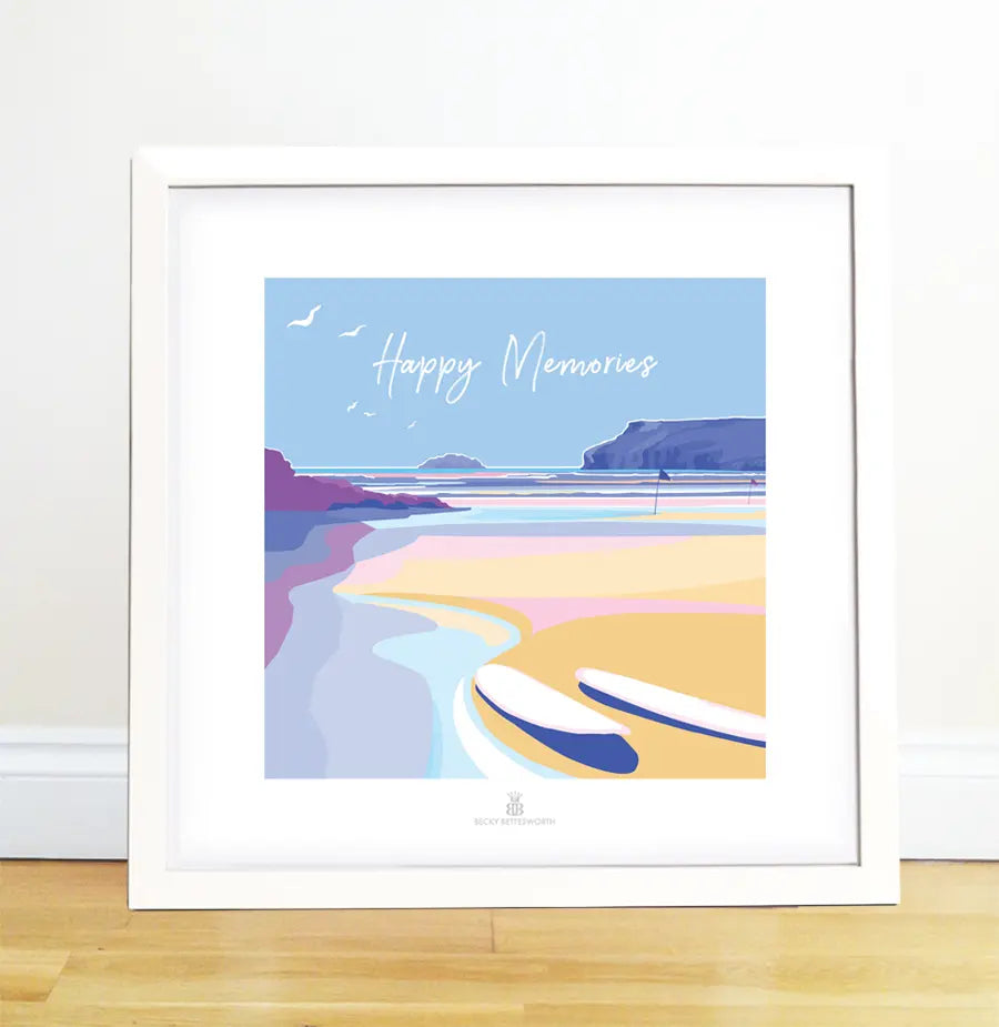 The framed artwork Happy Memories by BeckyBettesworth features a serene beach scene like classic 1930s travel posters, with a surfboard on the sandy shore, cliffs in the background, and a clear blue sky overhead.